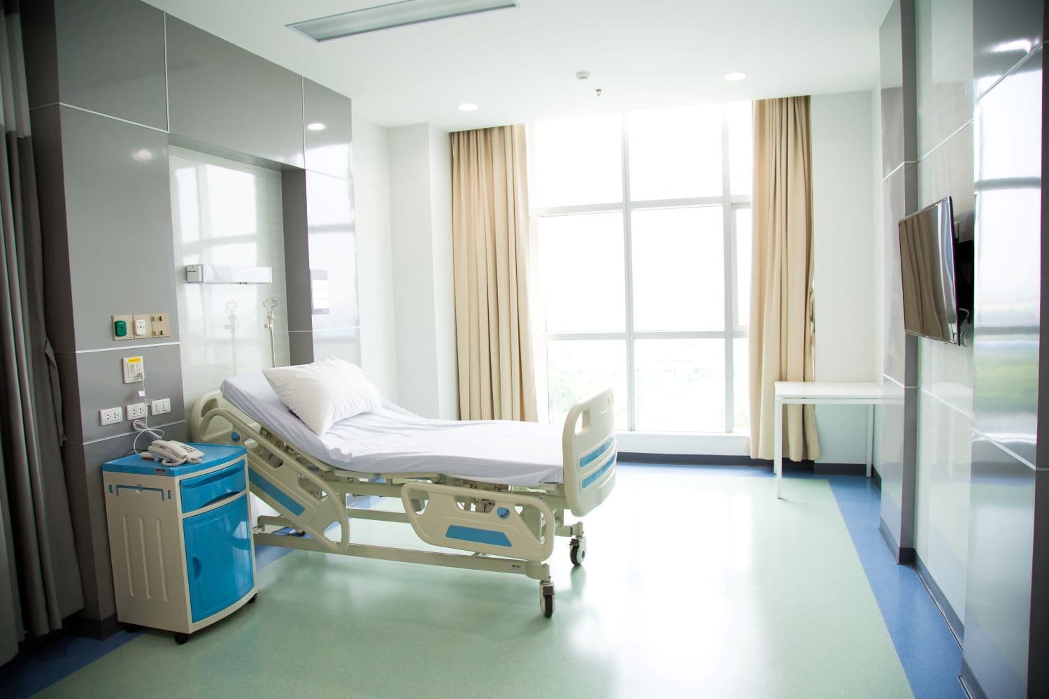 Recovery Room with beds and comfortable medical. Interior of an empty hospital room.